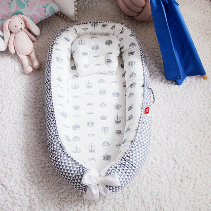 Réducteur de lit bébé 
