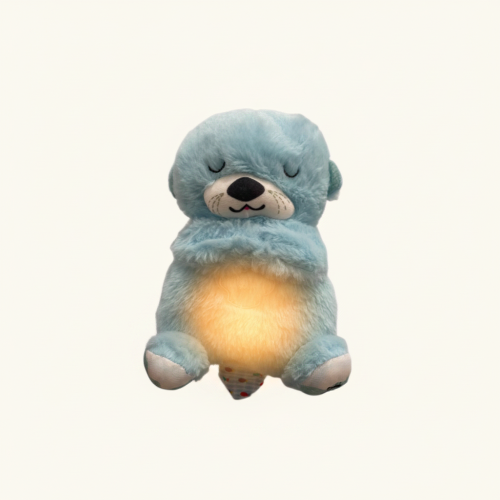 Doudou loutre bleu turquoise avec une douce lueur ambrée au ventre