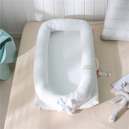 reducteur de lit blanc