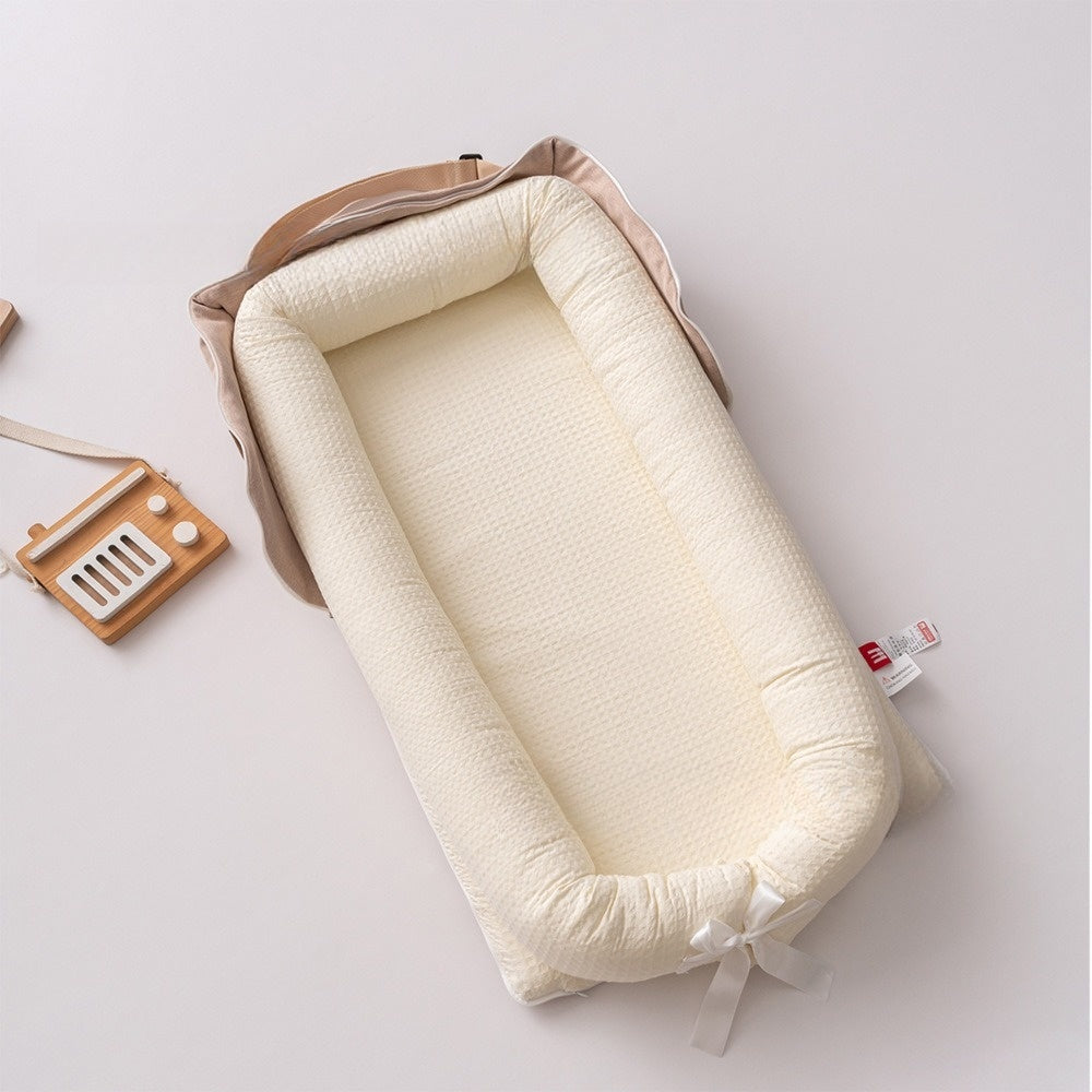 reducteur de lit bébé beige